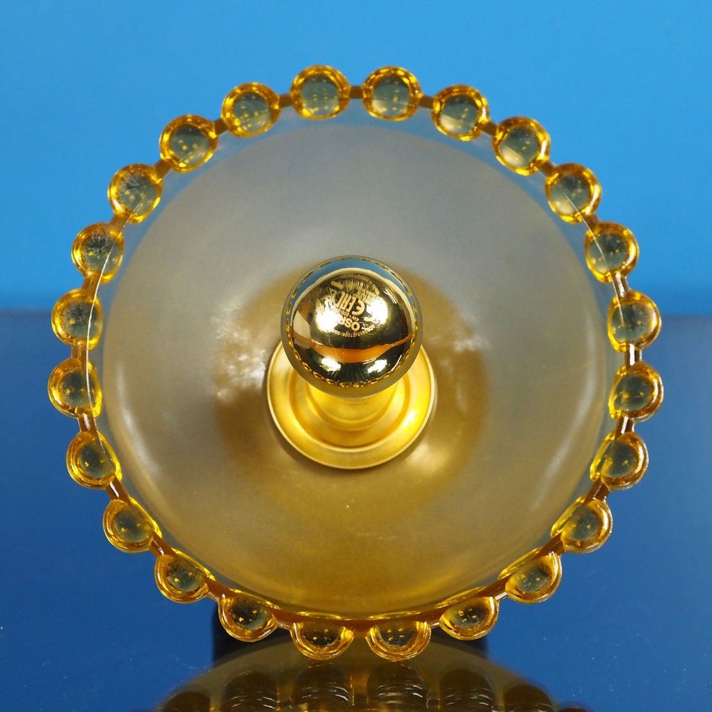 Wall sconce in orange ornate and textured glass