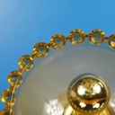 Wall sconce in orange ornate and textured glass