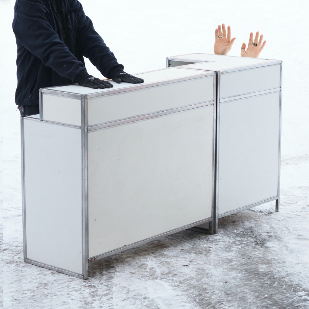 Corner reception desk with stainless steel frame and white laminate panels