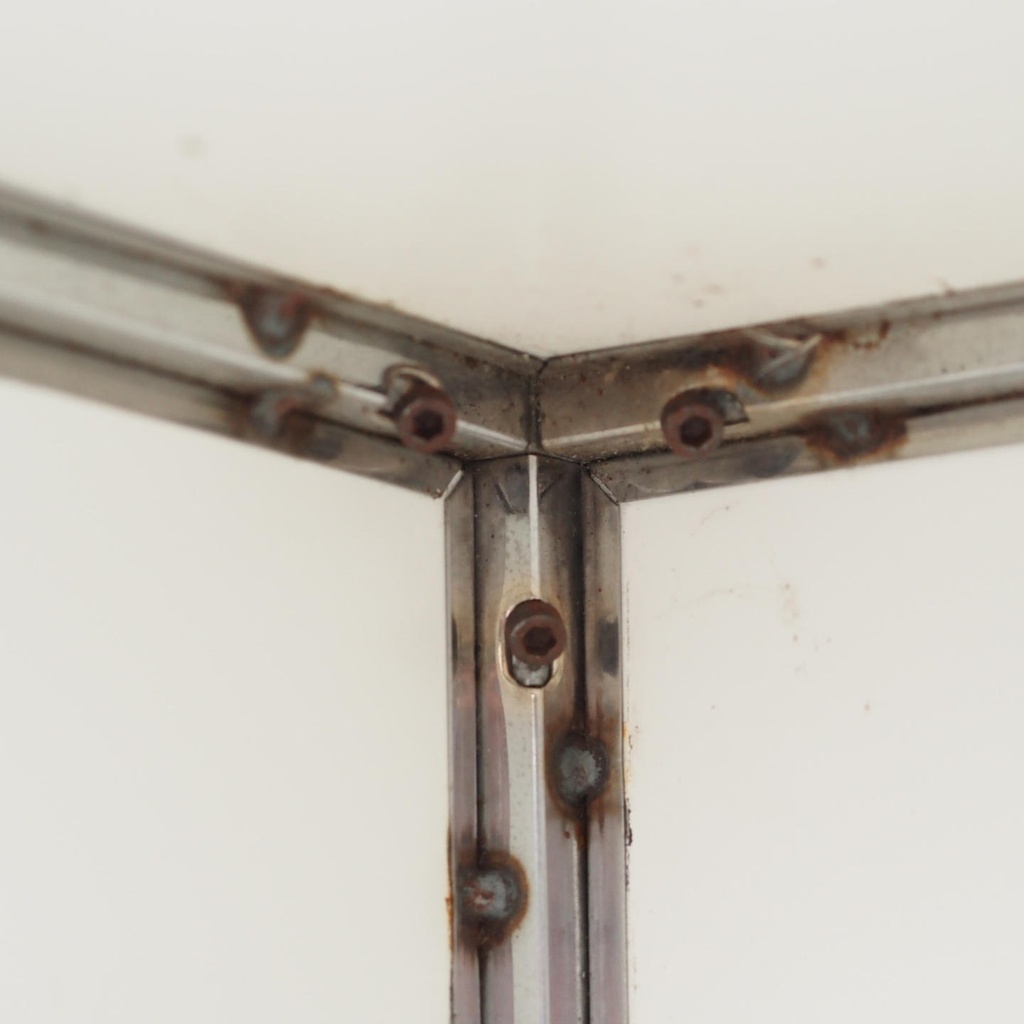 Reception desk with stainless steel frame and white laminate panels