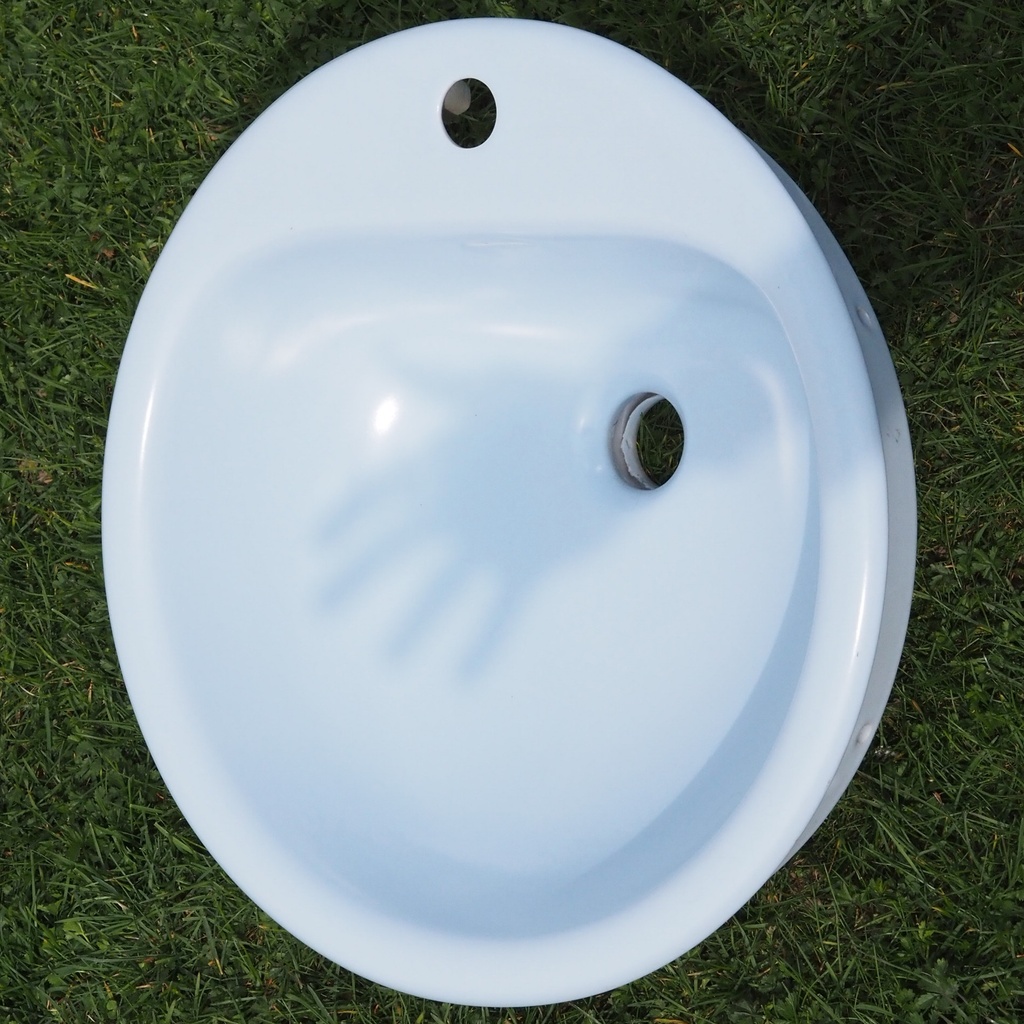 Light blue bathroom sink in ceramic