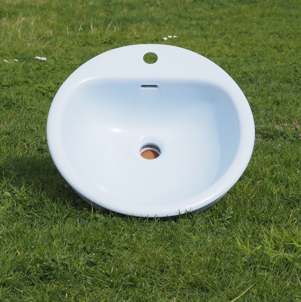 Light blue bathroom sink in ceramic