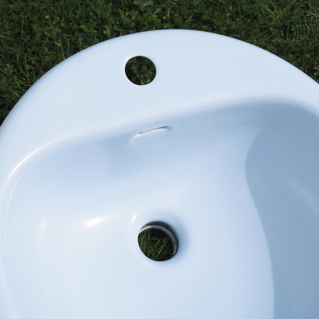 Light blue bathroom sink in ceramic