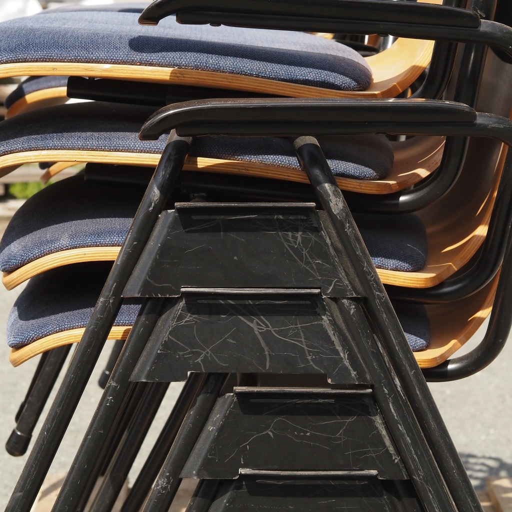 Armchair in varnished curved plywood with blue upholstery