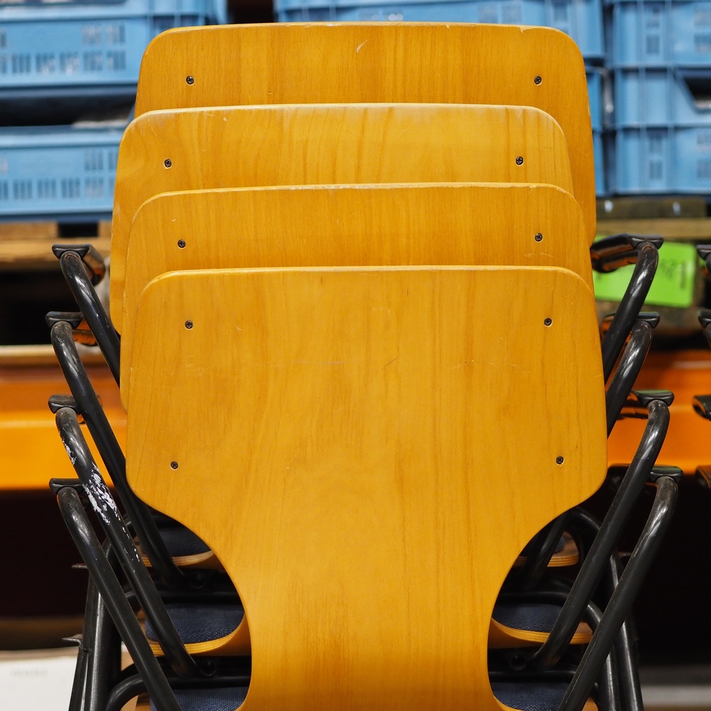 Upholstered armchair in varnished beech plywood and powder coated steel