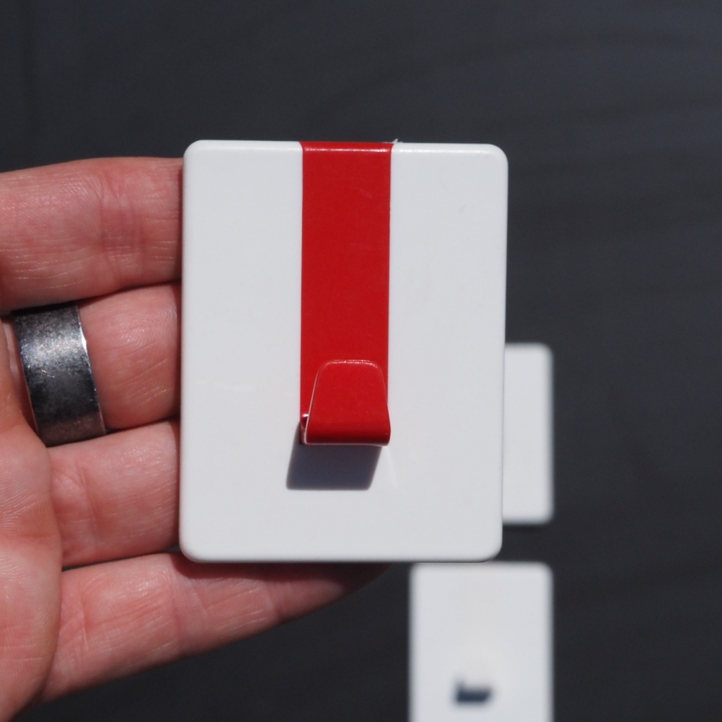 Wall hook with adhesive back