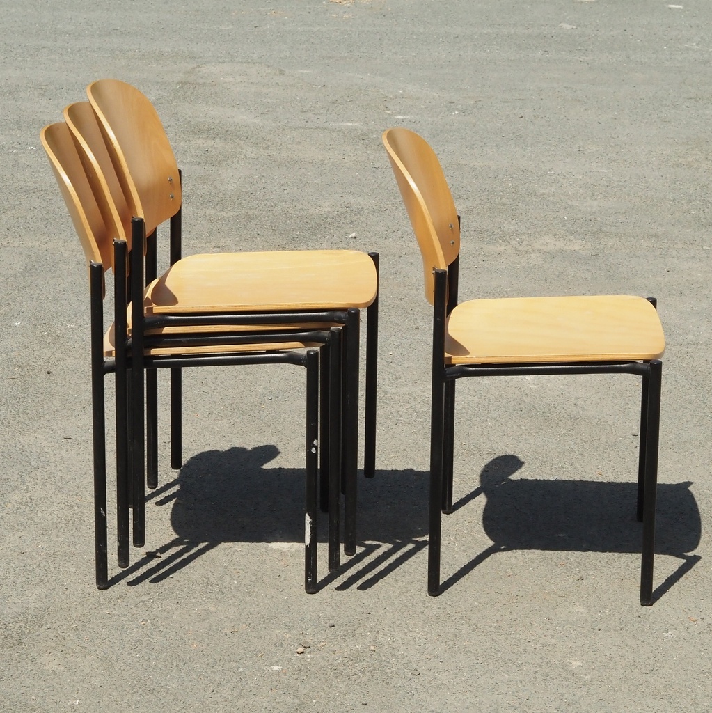 Stackable chair in varnished beech plywood and powder coated steel