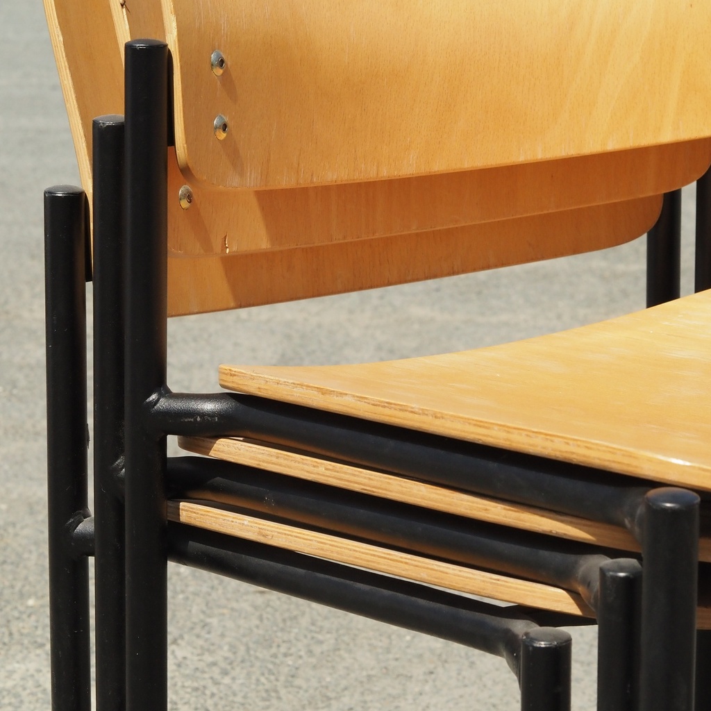 Stackable chair in varnished beech plywood and powder coated steel