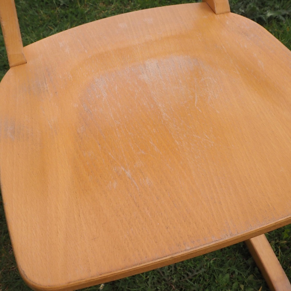 Stackable chair in varnished beech plywood and powder coated steel