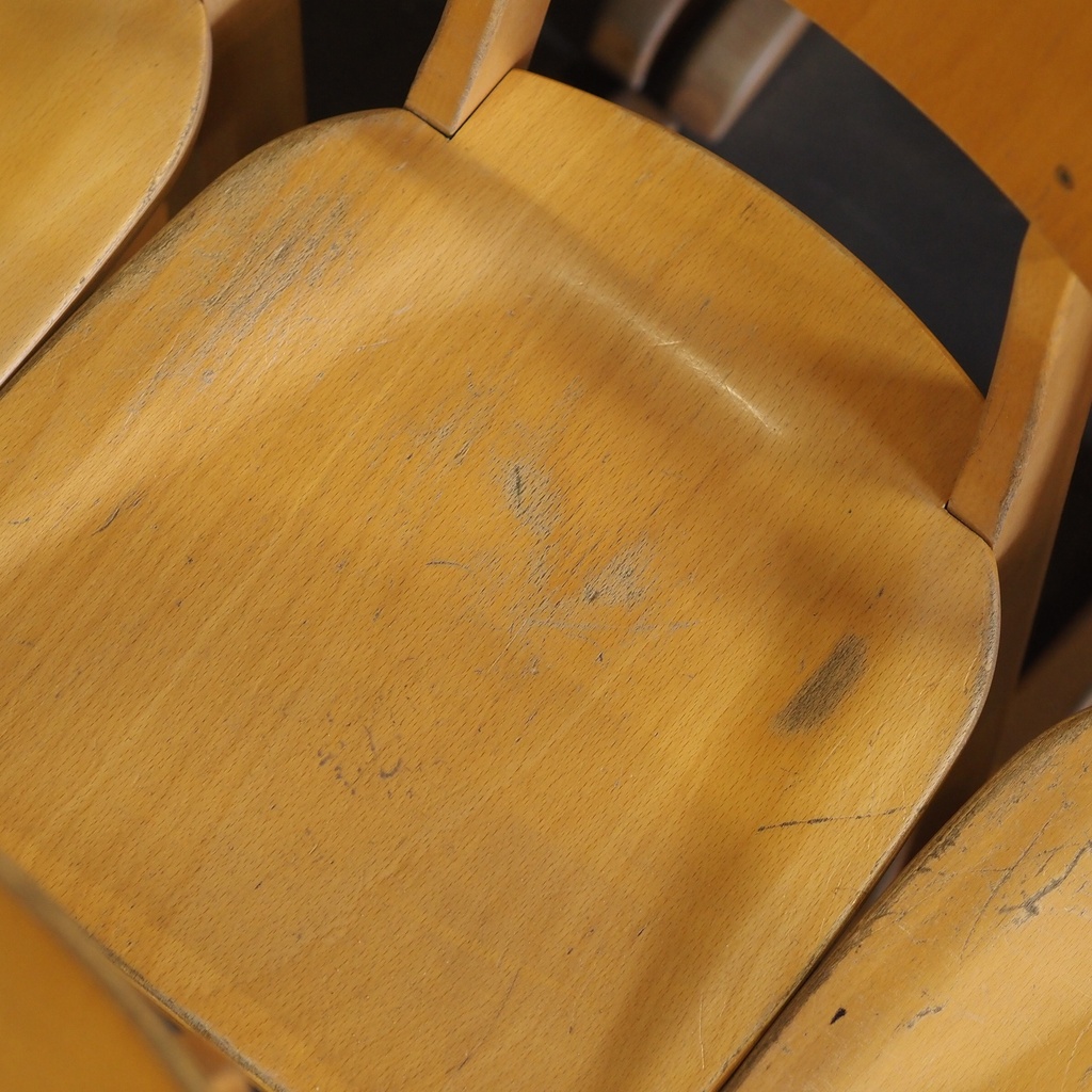 Stackable chair in varnished beech plywood and powder coated steel
