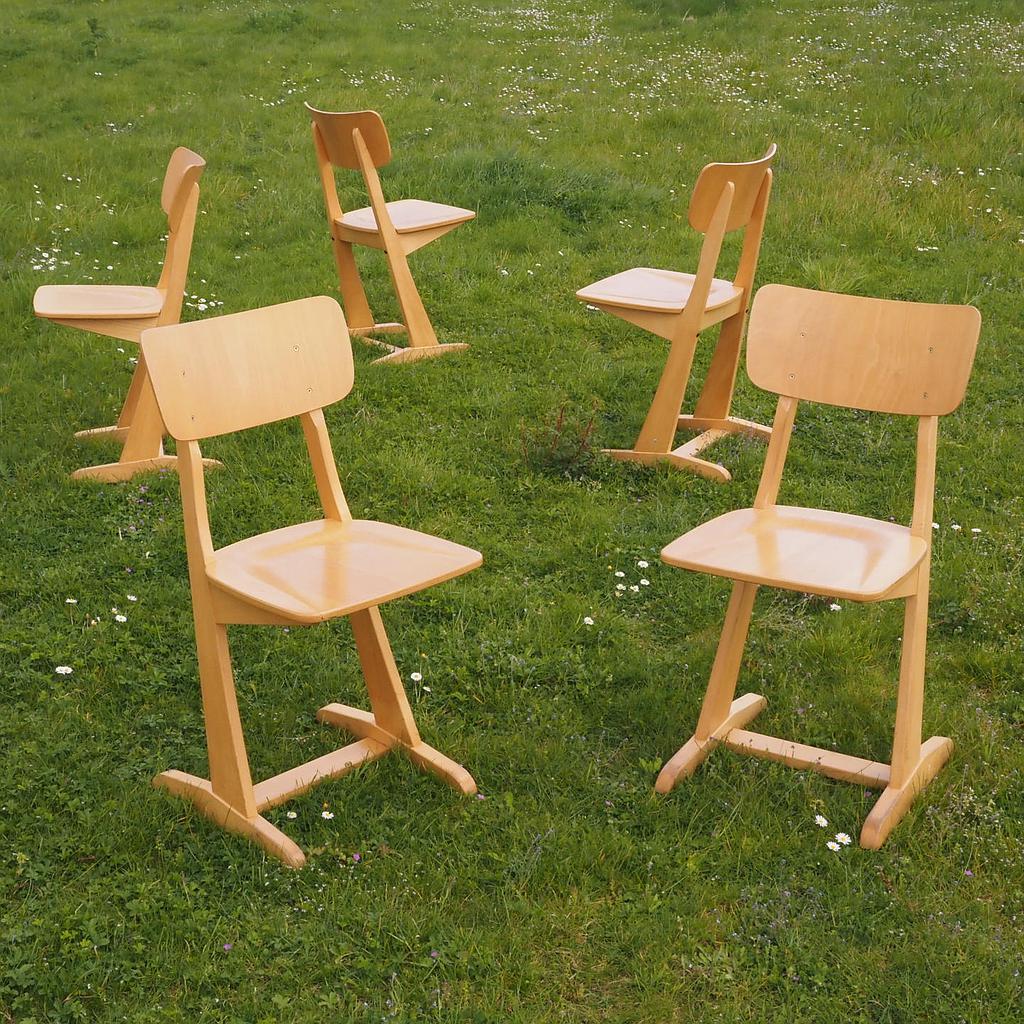 Stackable chair in varnished beech plywood and powder coated steel
