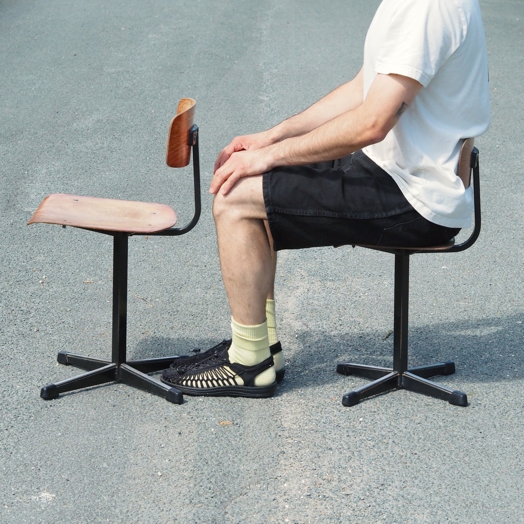 Stackable chair in varnished beech plywood and powder coated steel