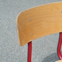 Stackable chair in varnished beech plywood and powder coated steel