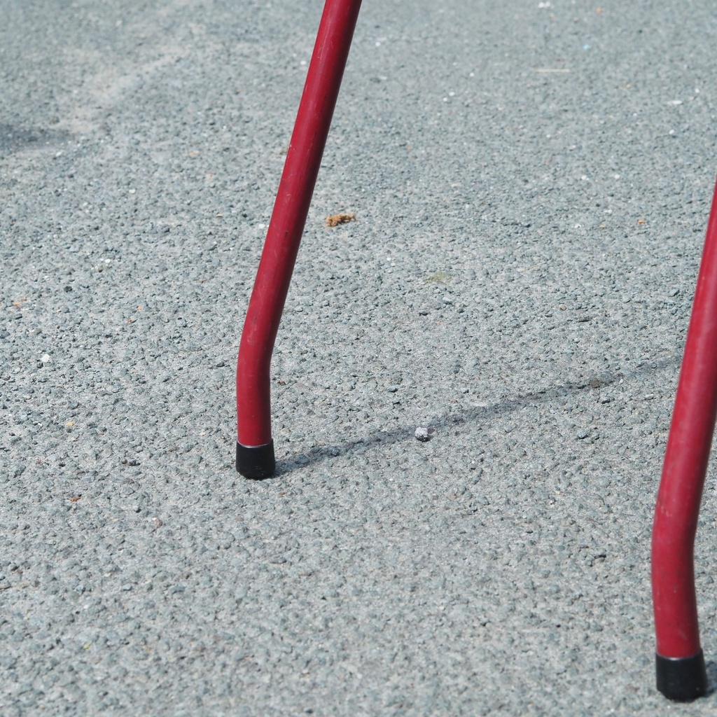 Stackable chair in varnished beech plywood and powder coated steel