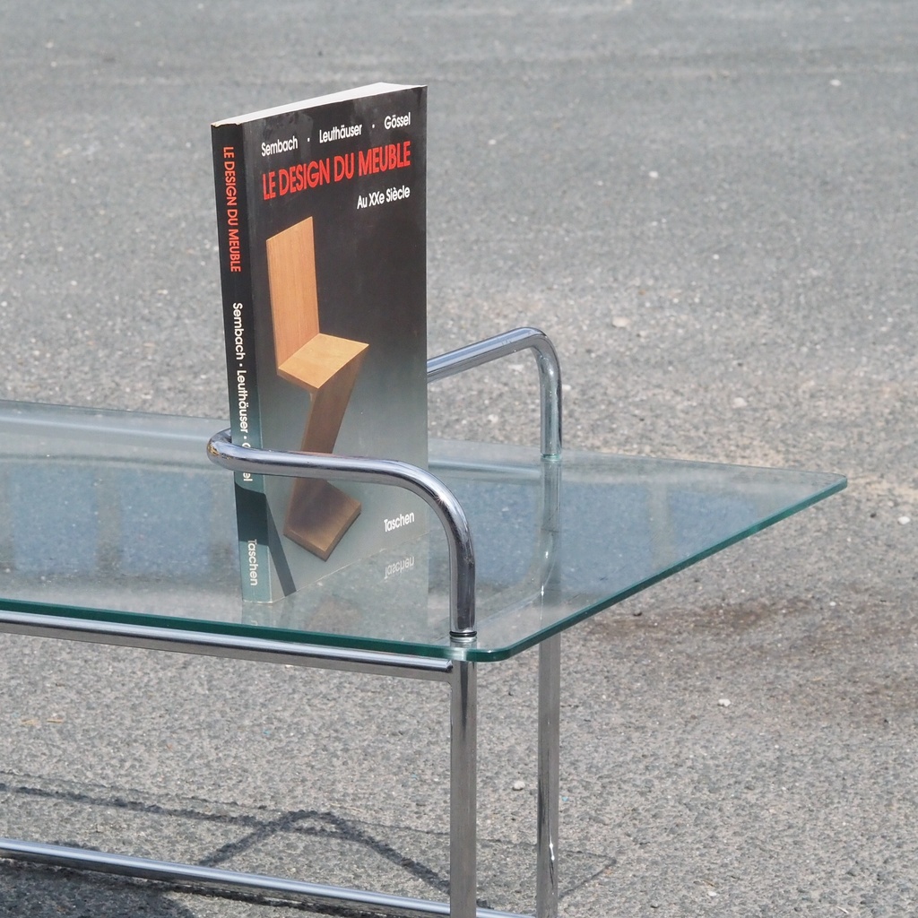 Coffee table in chromed steel with smoked glass tabletop and rotating tablets