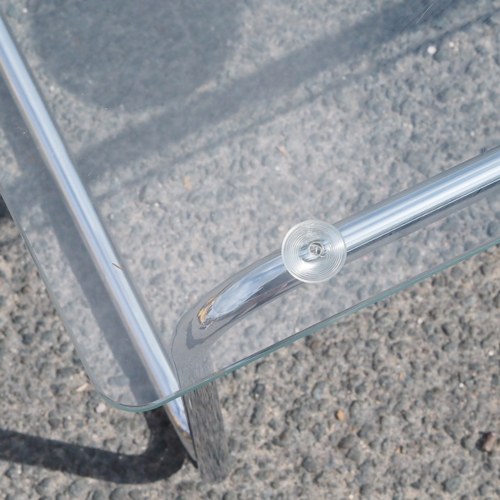 Coffee table in chromed tubular steel with clear glass tabletop
