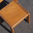 Stackable chair in varnished beech plywood and powder coated steel