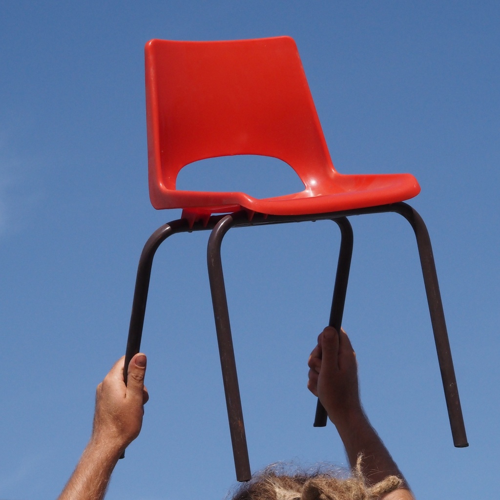 Stackable chair in varnished beech plywood and powder coated steel