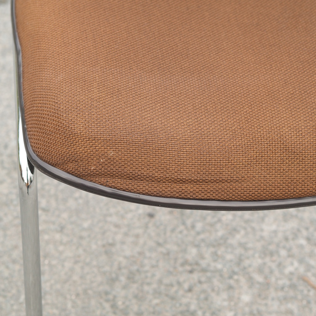 Conference chair in chromed steel and upholstered in brown fabric (ca. 1970)