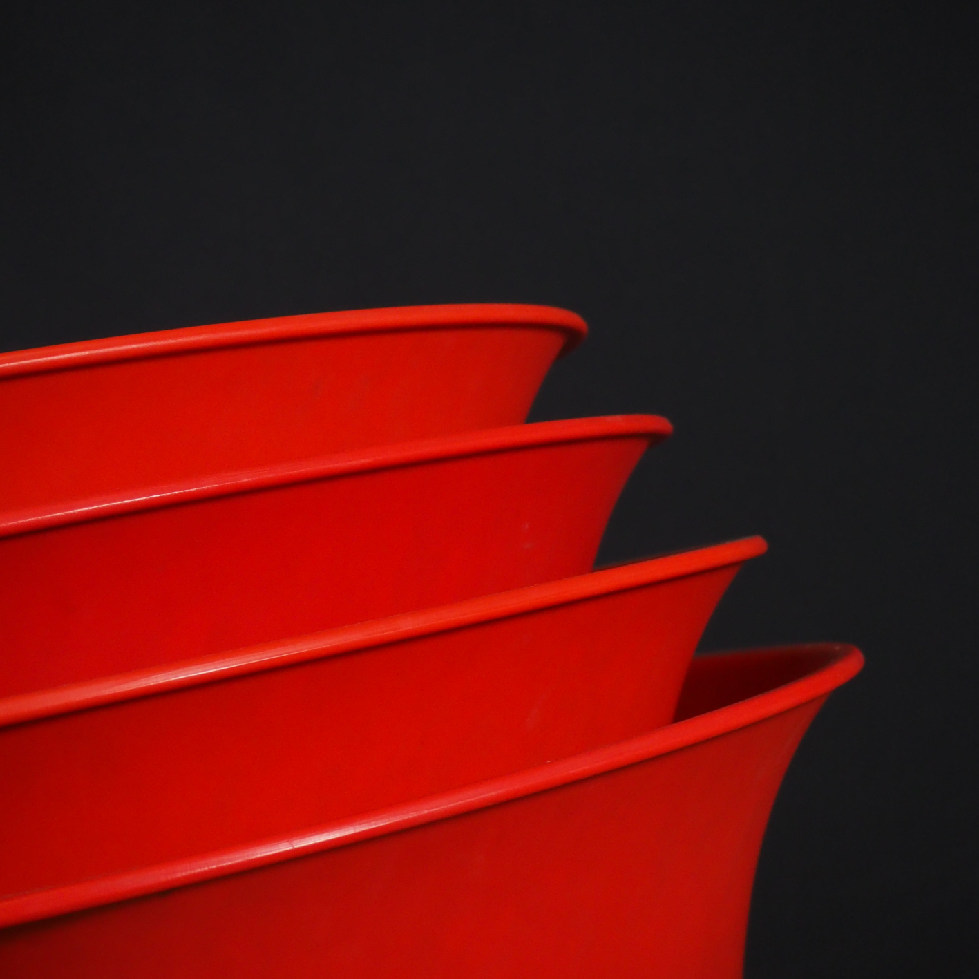 Stackable red chair 'Kicca' by Kastel