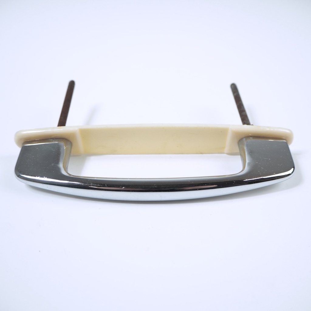 Chromed and "ivory" cabinet handle