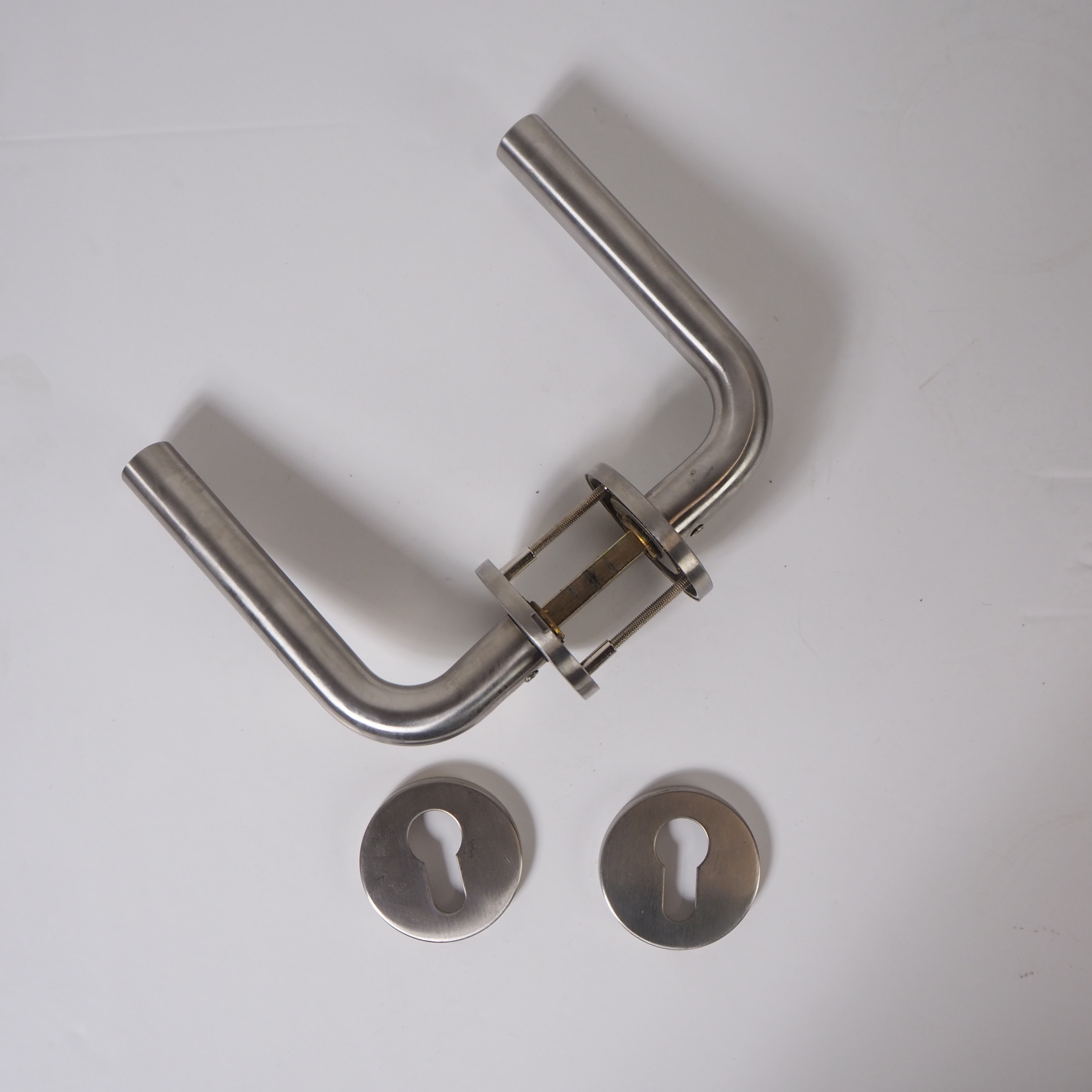 Stainless steel door handle with key rosettes