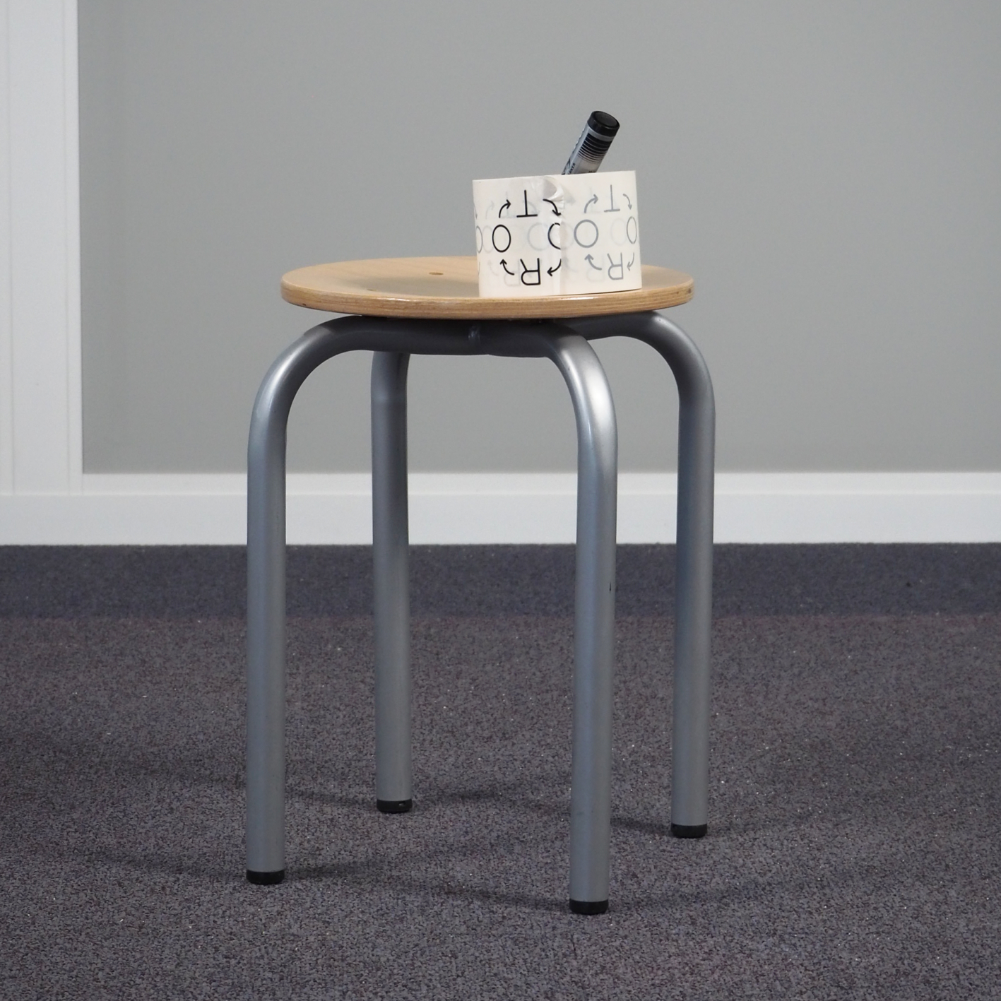 Small school stool with steel legs