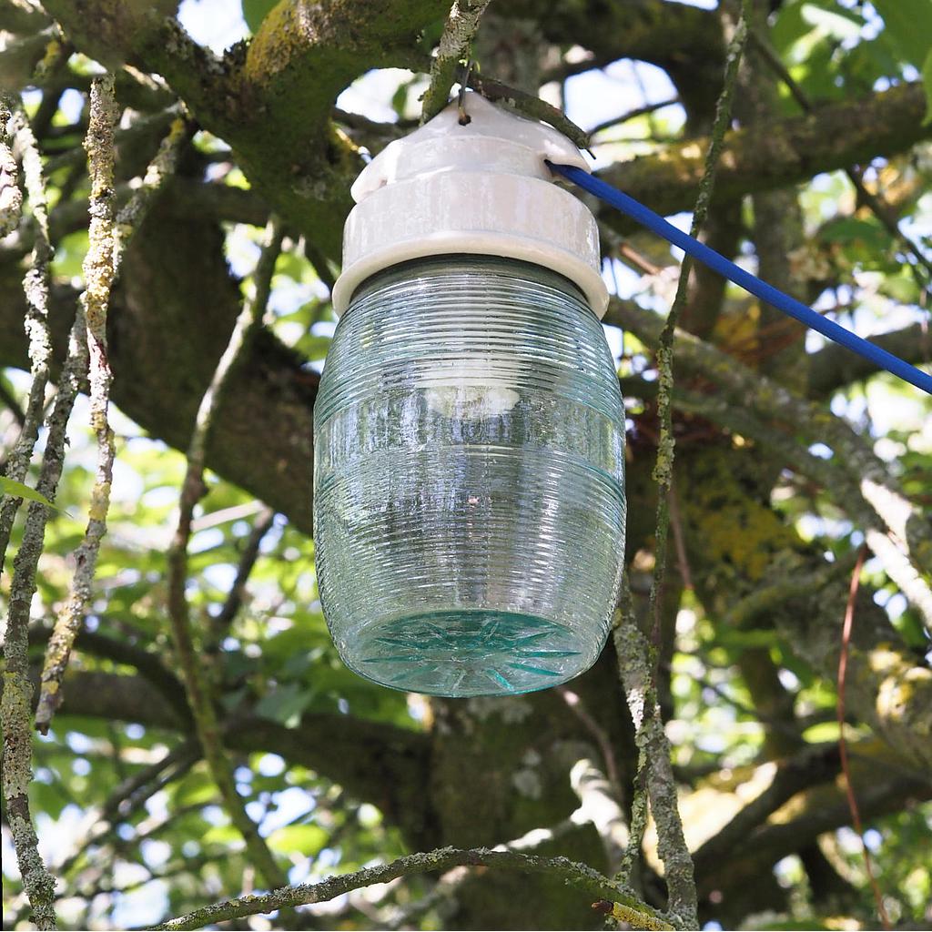 Industrial lantern with porcelain base and ribbed glass