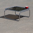 Coffee table with smoked tempered glass top and tubular chromed steel base