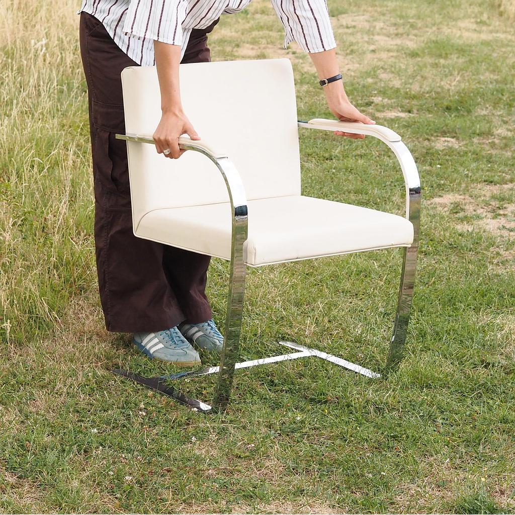 Cantilever armchair in chromed steel and synthetic leather