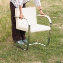 Cantilever armchair in chromed steel and synthetic leather