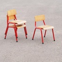 Stackable school chair with red tubular steel legs