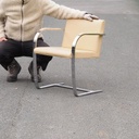 Armchair in chromed steel and synthetic leather