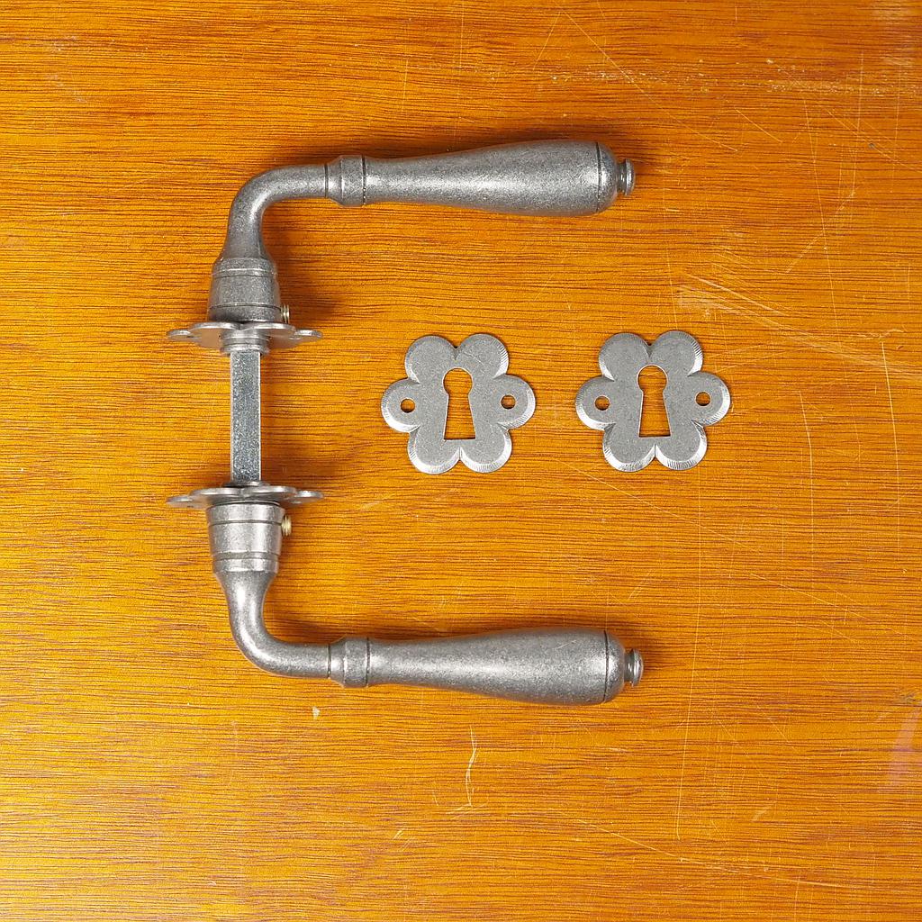 Door handle with key rosettes by Linea Bertomani