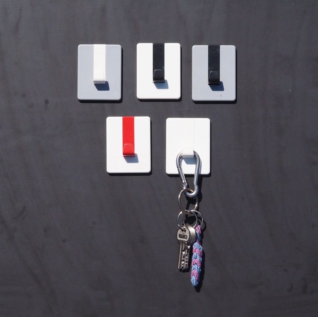 Wall hook with adhesive back