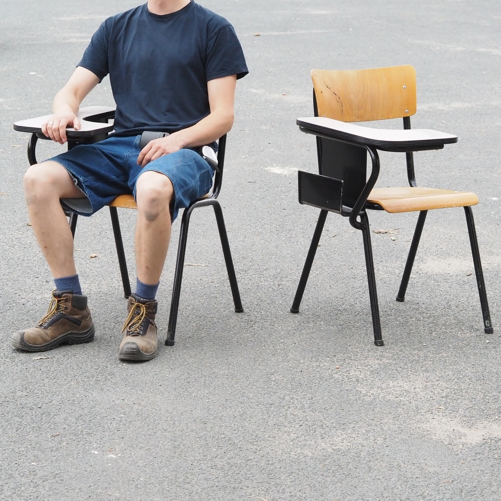 Conference chair with writing tablet