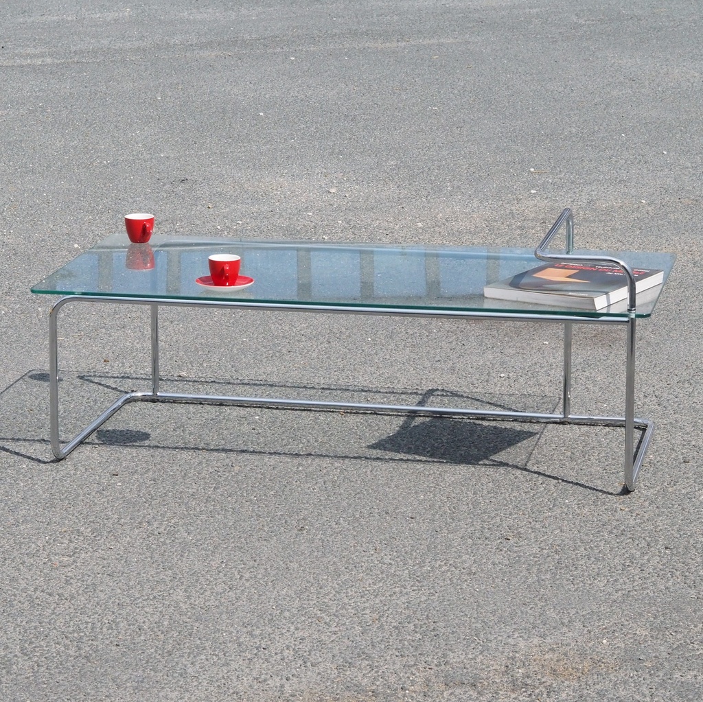 Coffee table in chromed tubular steel with clear glass tabletop (121 x 62 cm)