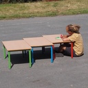 Low school table with wooden laminated table top and colorful lacquered steel legs (H. 46 cm)