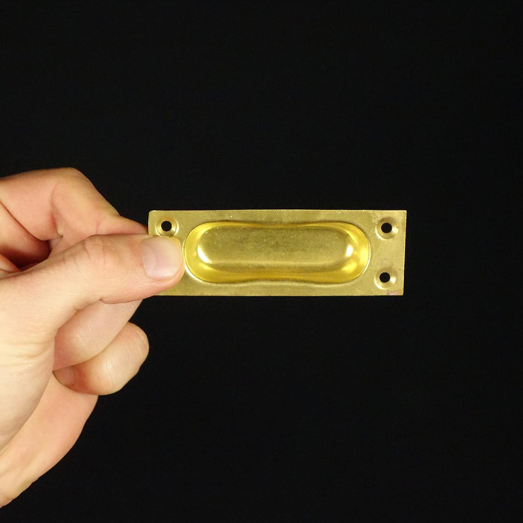 Inset cabinet handle in brass