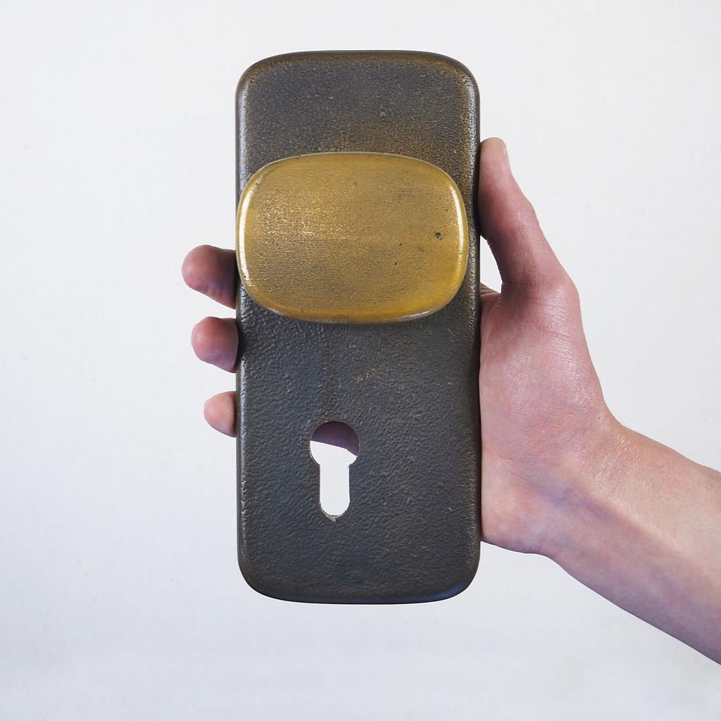 Door handle in sand-cast bronze by Jules Wabbes from the Générale de Banque - Double sided