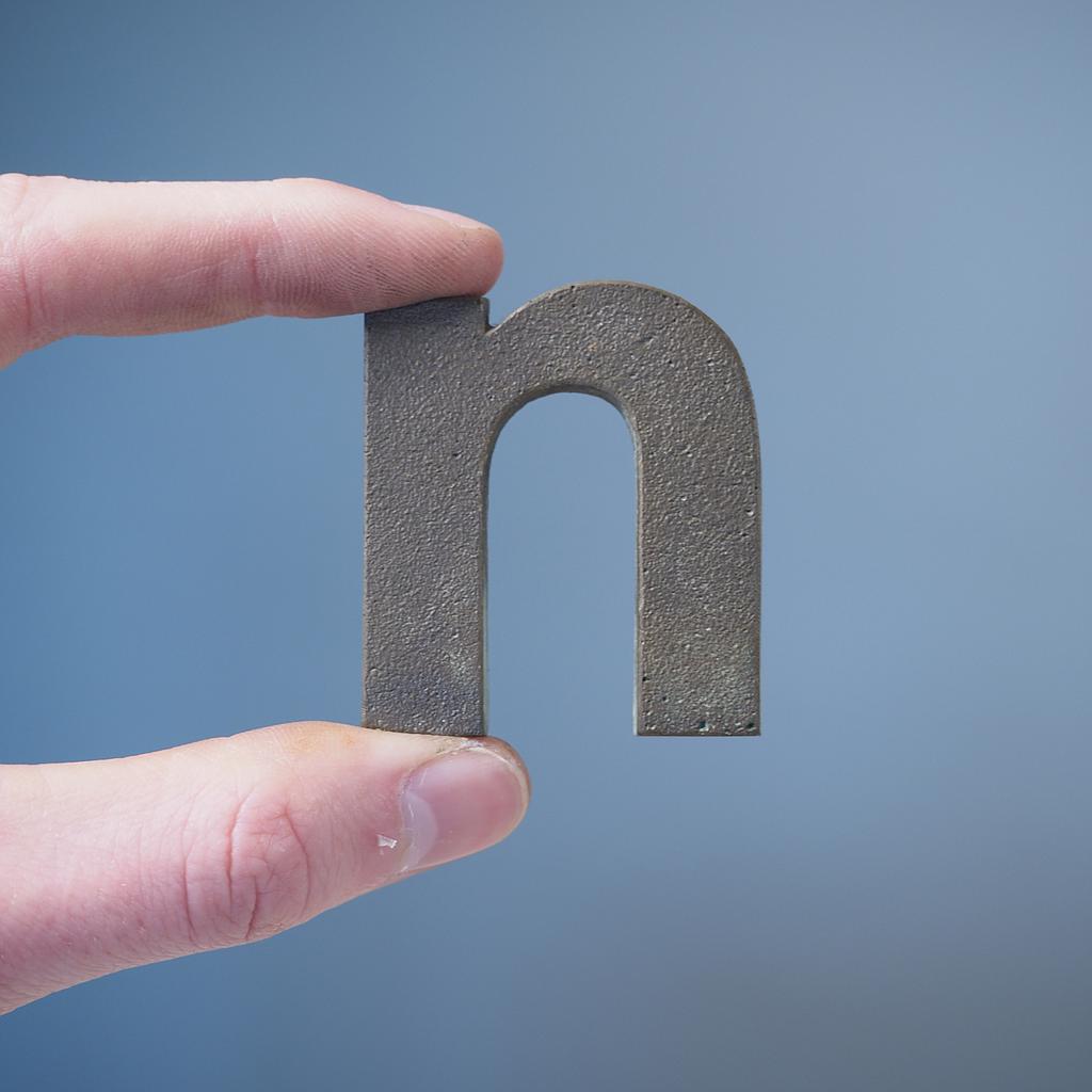 [005HAR0041] Letter 'n' in sand-cast bronze by Jules Wabbes from the Générale de Banque