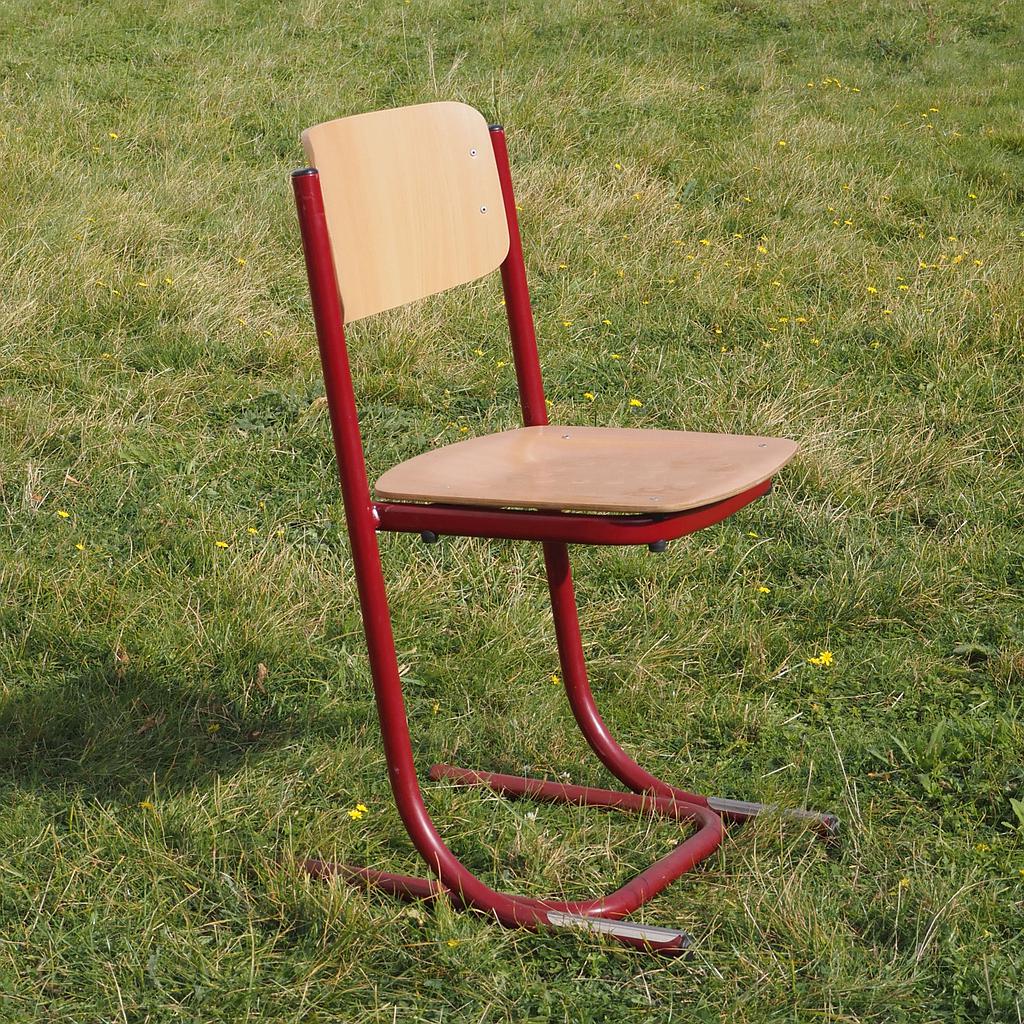 Cantilever chair with textured plywood seat and powder-coated steel legs