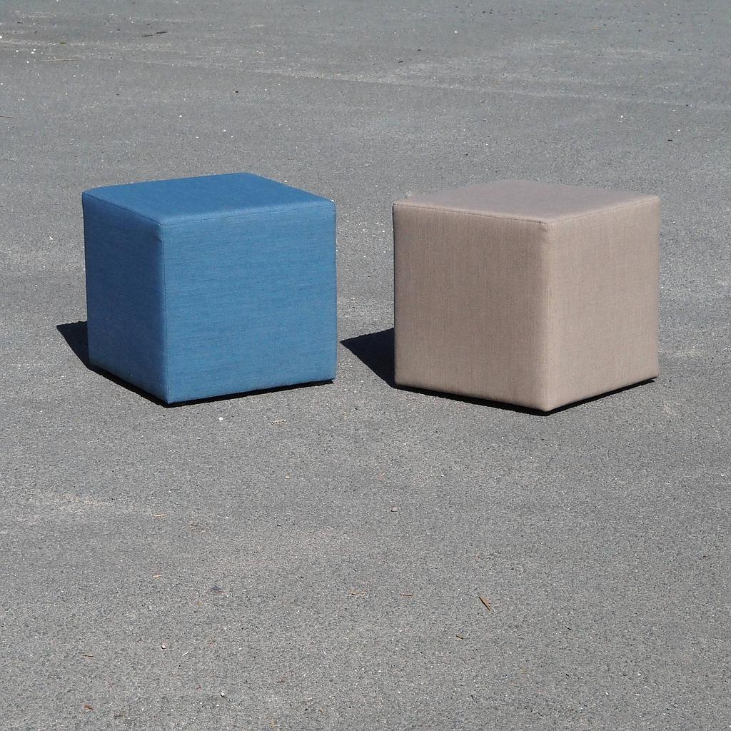 Square ottoman upholstered in grey or blue fabric