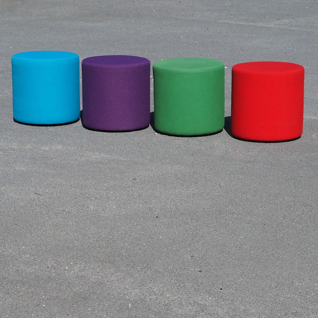 Round ottoman upholstered in various colorful fabric