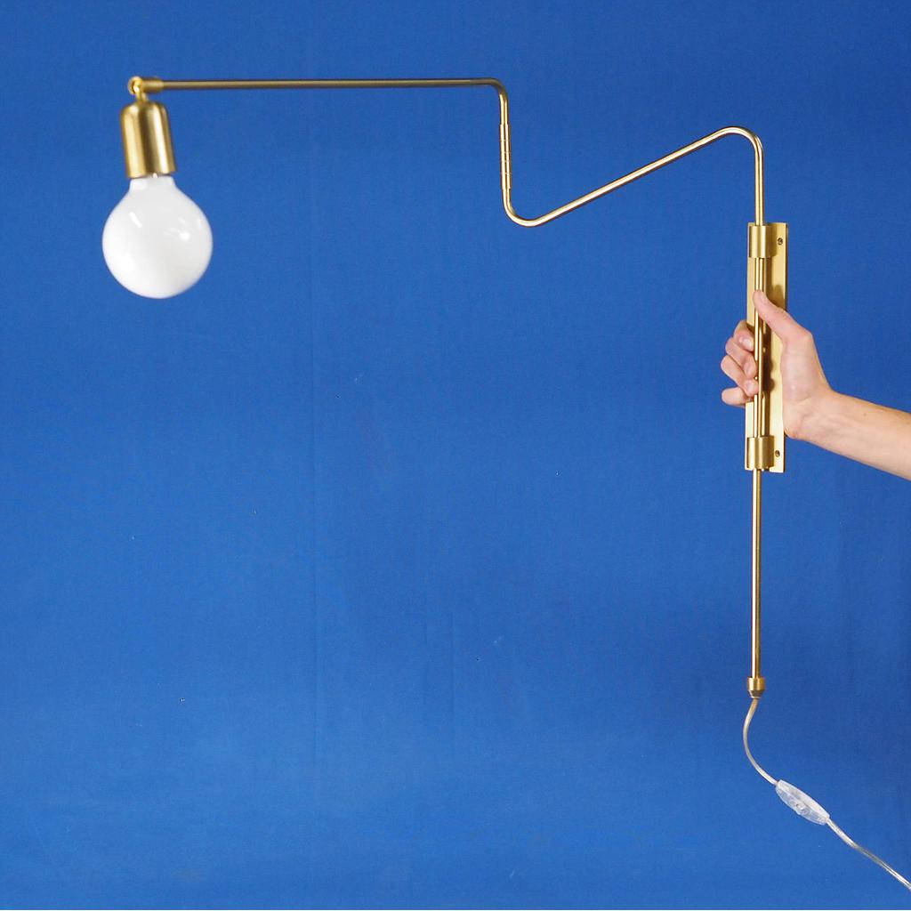 Articulated wall light 'Swing' with brass finish by House Doctor