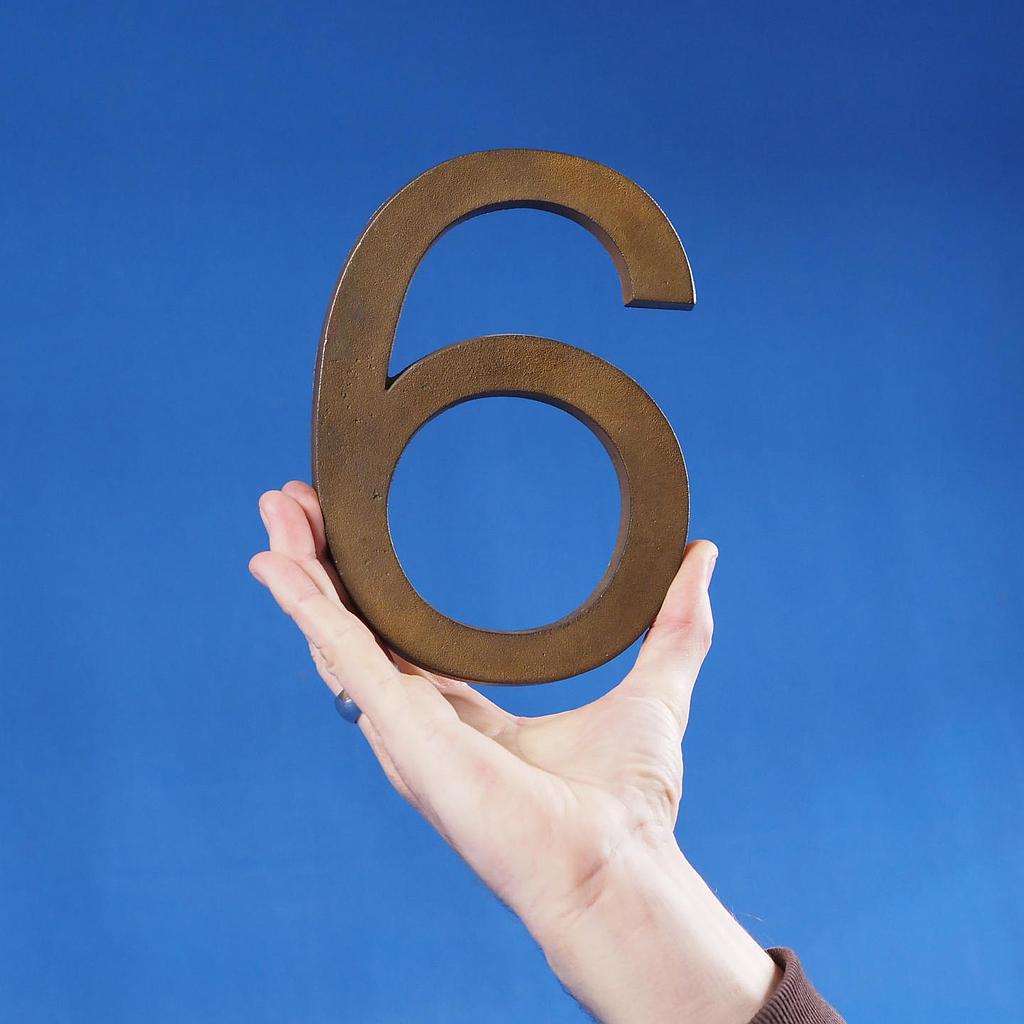 Floor number '6' in sand-cast solid bronze by Jules Wabbes from the Générale de Banque