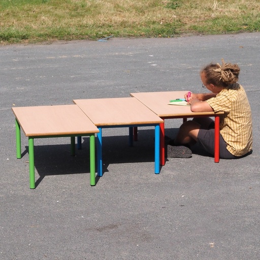 Low school table with wooden laminated table top and lacquered steel legs