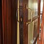 Solid varnished wooden door with glass panels