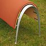 Simple waiting bench in curved plywood and textile cover with glass tablet - Dark Orange