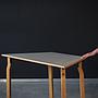 Geometric table with laminated table top and